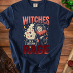 Navy t-shirt with "Witches of a Certain Rage" text and witch graphic.