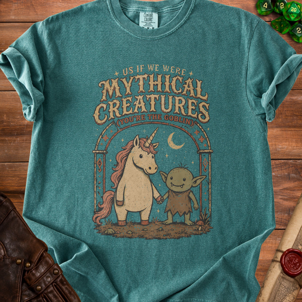 T-shirt with graphic of unicorn and goblin holding hands, "Mythical Creatures" text.