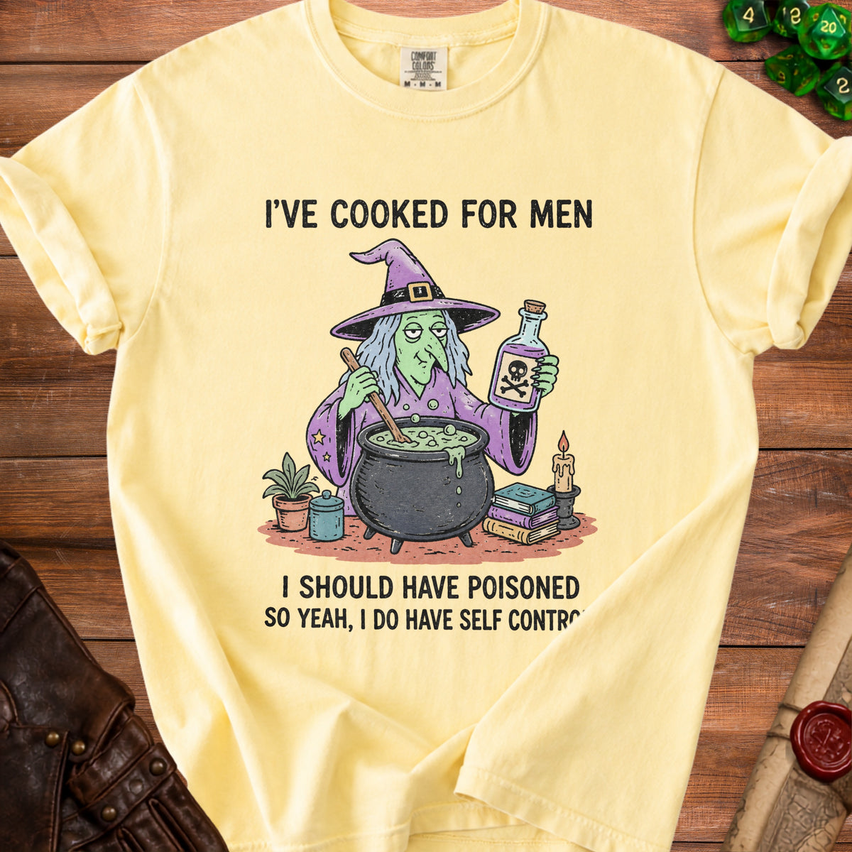 Yellow t-shirt with cartoon witch and text: "I've cooked for men. I should have poisoned. So yeah, I do have self control."