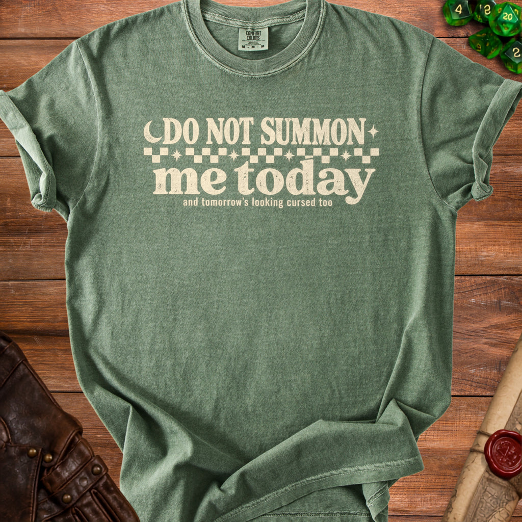 Green t-shirt with "Do not summon me today and tomorrow's looking cursed too" text.