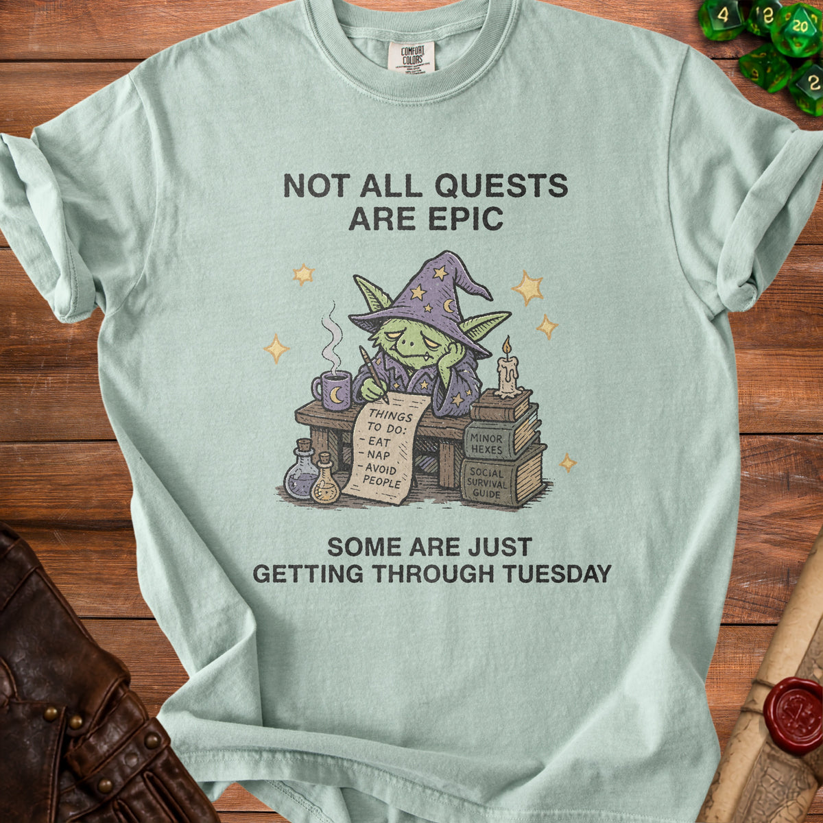 Light blue t-shirt with a goblin wizard writing "things to do: eat, nap, avoid people".