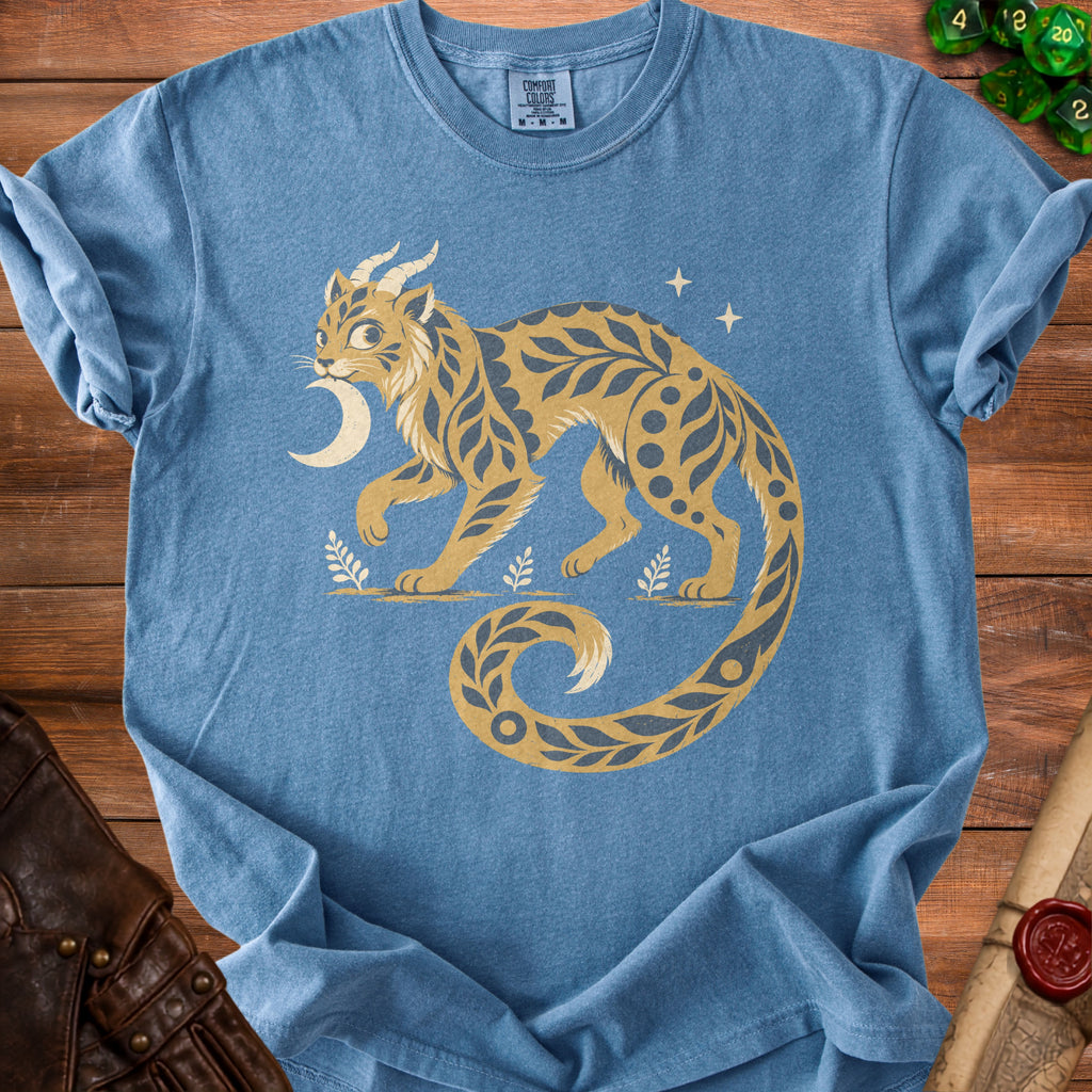 Blue t-shirt with a golden creature with moon and stars, Comfort Colors M tag.