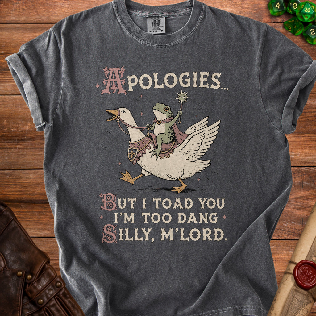 Dark gray t-shirt with a frog riding a goose and text "Apologies... But I toad you I'm too dang silly, m'lord."