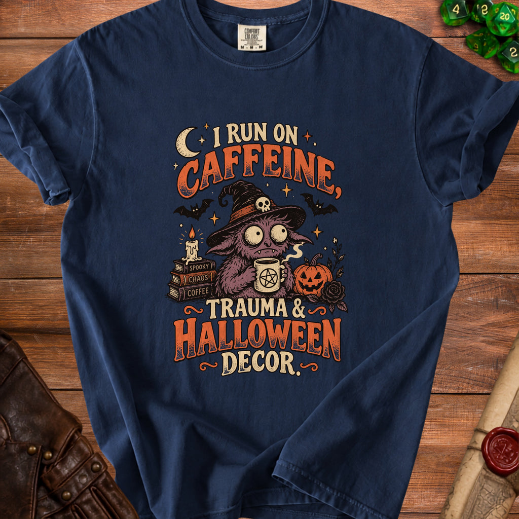 Dark blue t-shirt with graphic "I run on caffeine, trauma & Halloween decor."