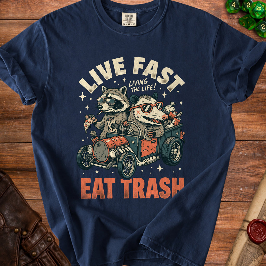 Navy t-shirt with graphic of raccoon and opossum driving a car, reading "LIVE FAST EAT TRASH".