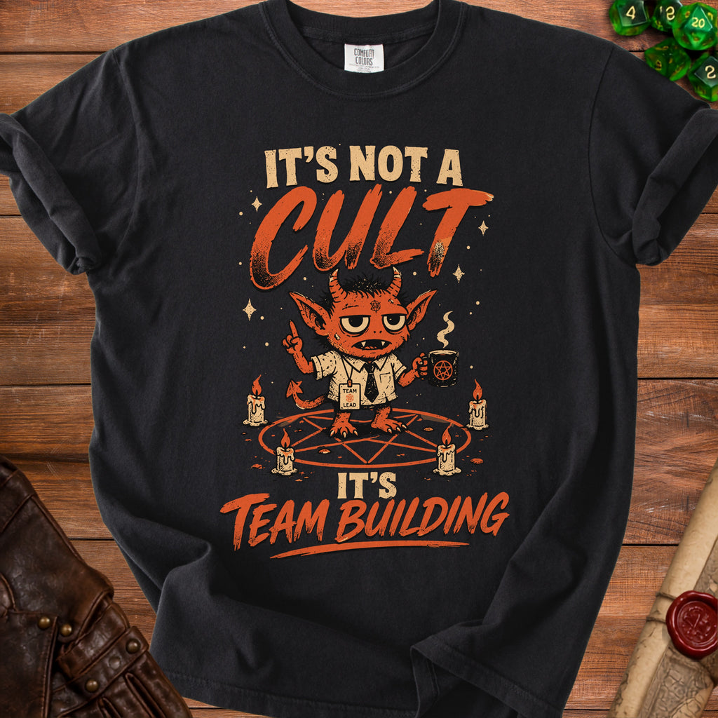Black t-shirt with text "It's Not A Cult, It's Team Building" and cartoon devil.