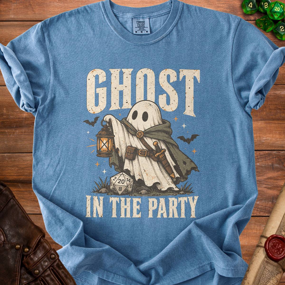 Blue t-shirt with a ghost holding a lantern and the text "GHOST IN THE PARTY".