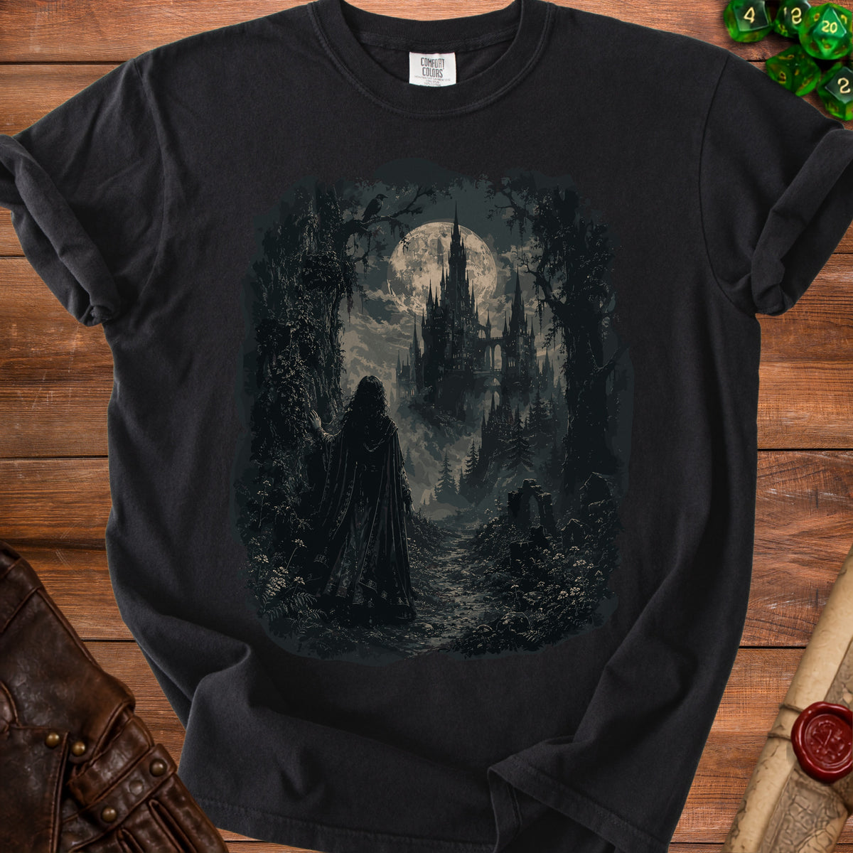 Black t-shirt with a dark fantasy print of a cloaked figure facing a castle under a full moon.