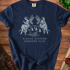 Navy t-shirt with two fairies, flowers, and text "Please Disturb Someone Else".
