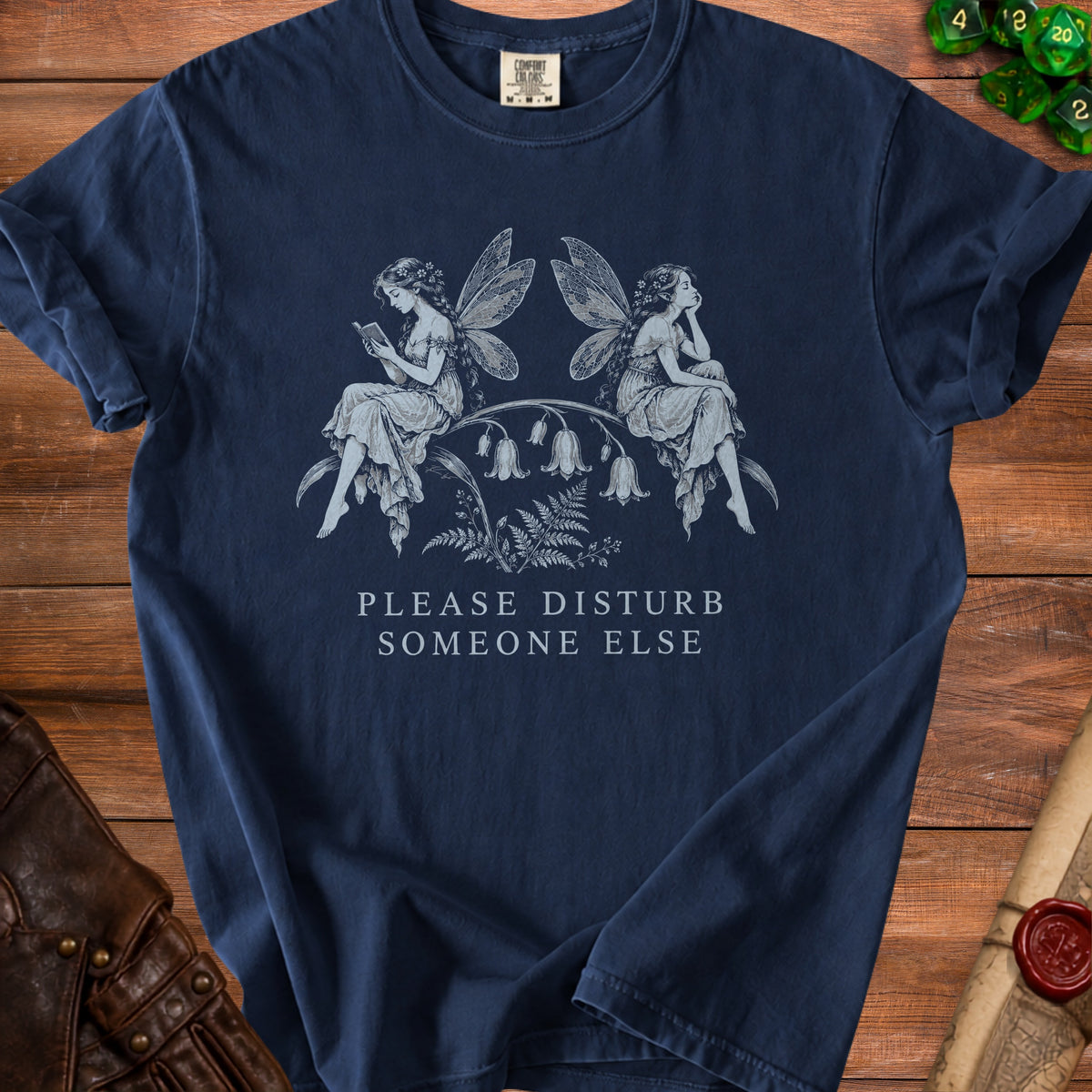Navy t-shirt with two fairies, flowers, and text "Please Disturb Someone Else".