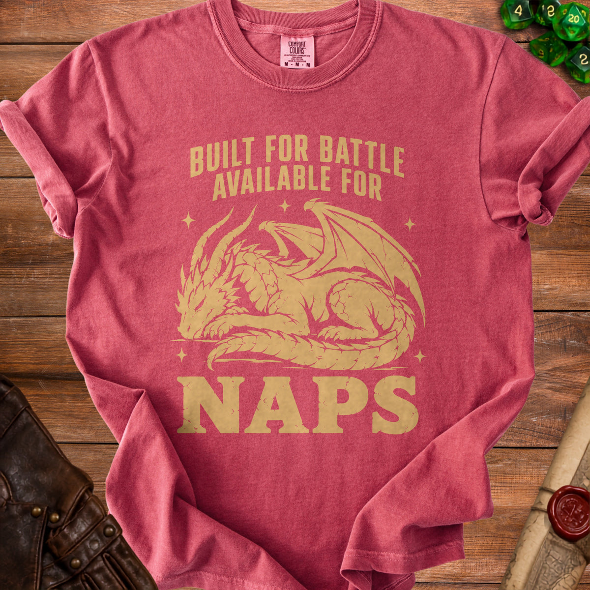 Pink t-shirt with gold dragon graphic and text "Built for battle available for naps".