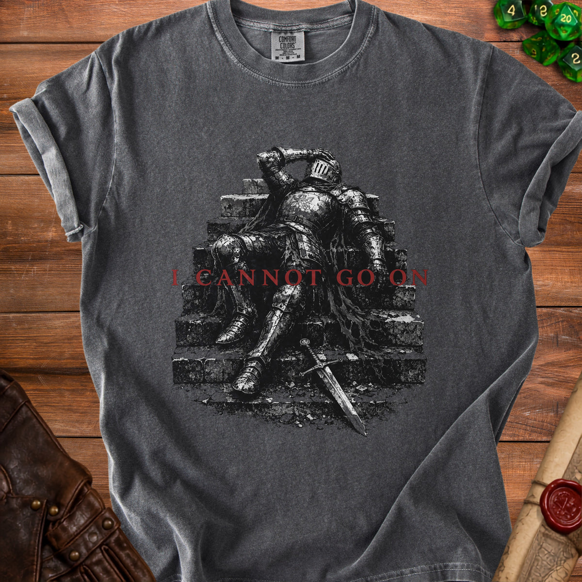 Dark gray t-shirt with a knight on stairs graphic and "I CANNOT GO ON" text.