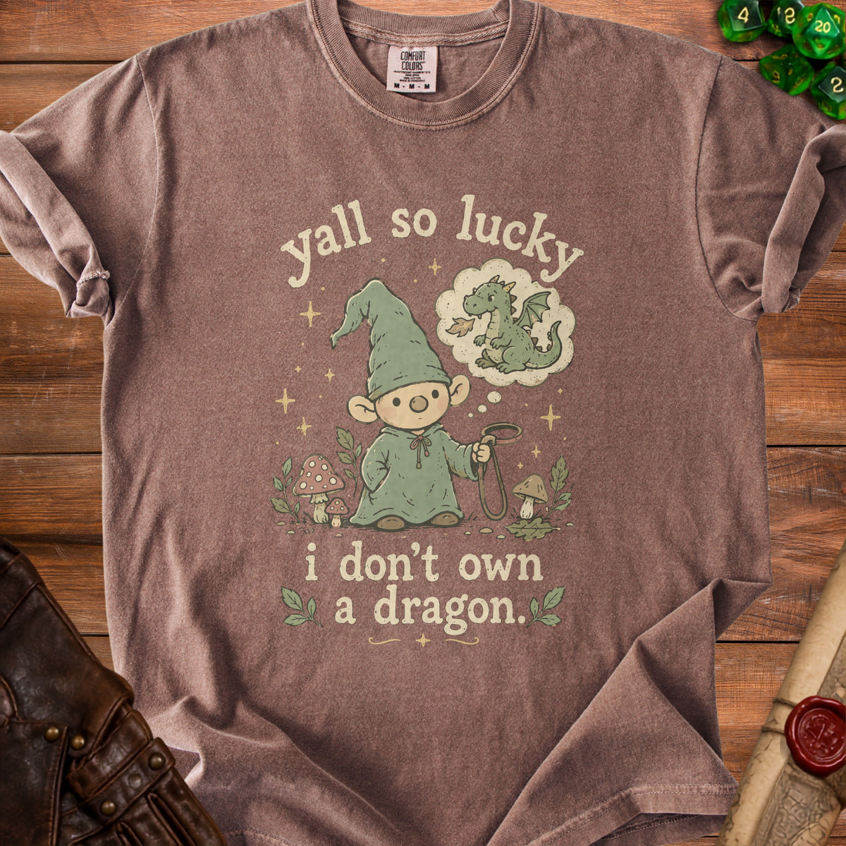 T-shirt with gnome dreaming of a dragon, text "yall so lucky i don't own a dragon."