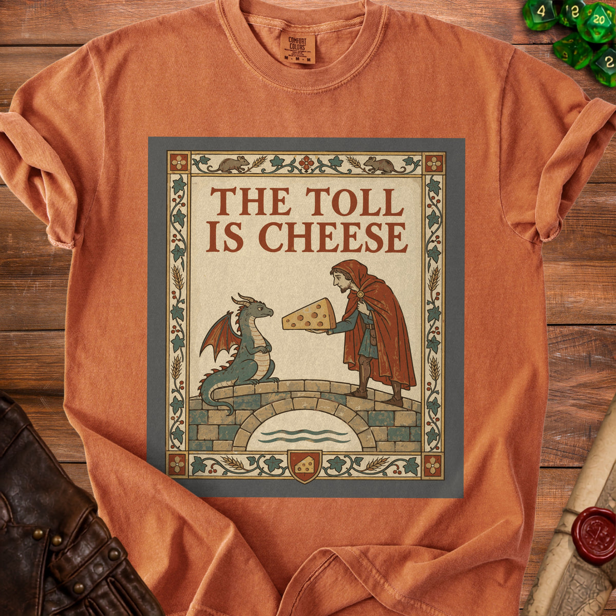 T-shirt graphic with dragon and man on bridge, text "THE TOLL IS CHEESE".