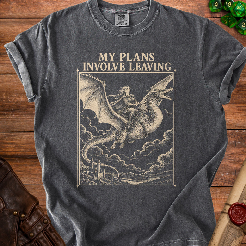 A charcoal gray t-shirt with a vintage-style graphic of a woman riding a dragon above a castle, accompanied by the text "MY PLANS INVOLVE LEAVING."