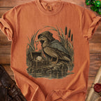 Duck in a hooded cloak holding a key next to a treasure chest and dice.