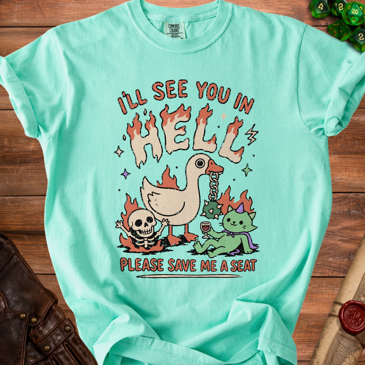 Teal t-shirt with graphic text "I'LL SEE YOU IN HELL PLEASE SAVE ME A SEAT".