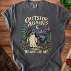 T-shirt with ghost explorer design, featuring text "OUTSIDE AGAIN? BRAVE OF ME."