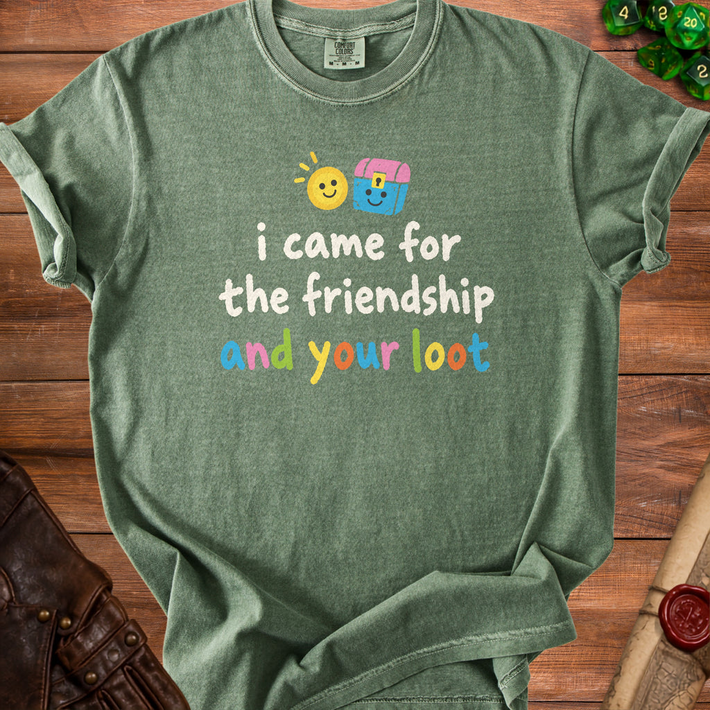 Green t-shirt with text "i came for the friendship and your loot" and cartoon graphics.