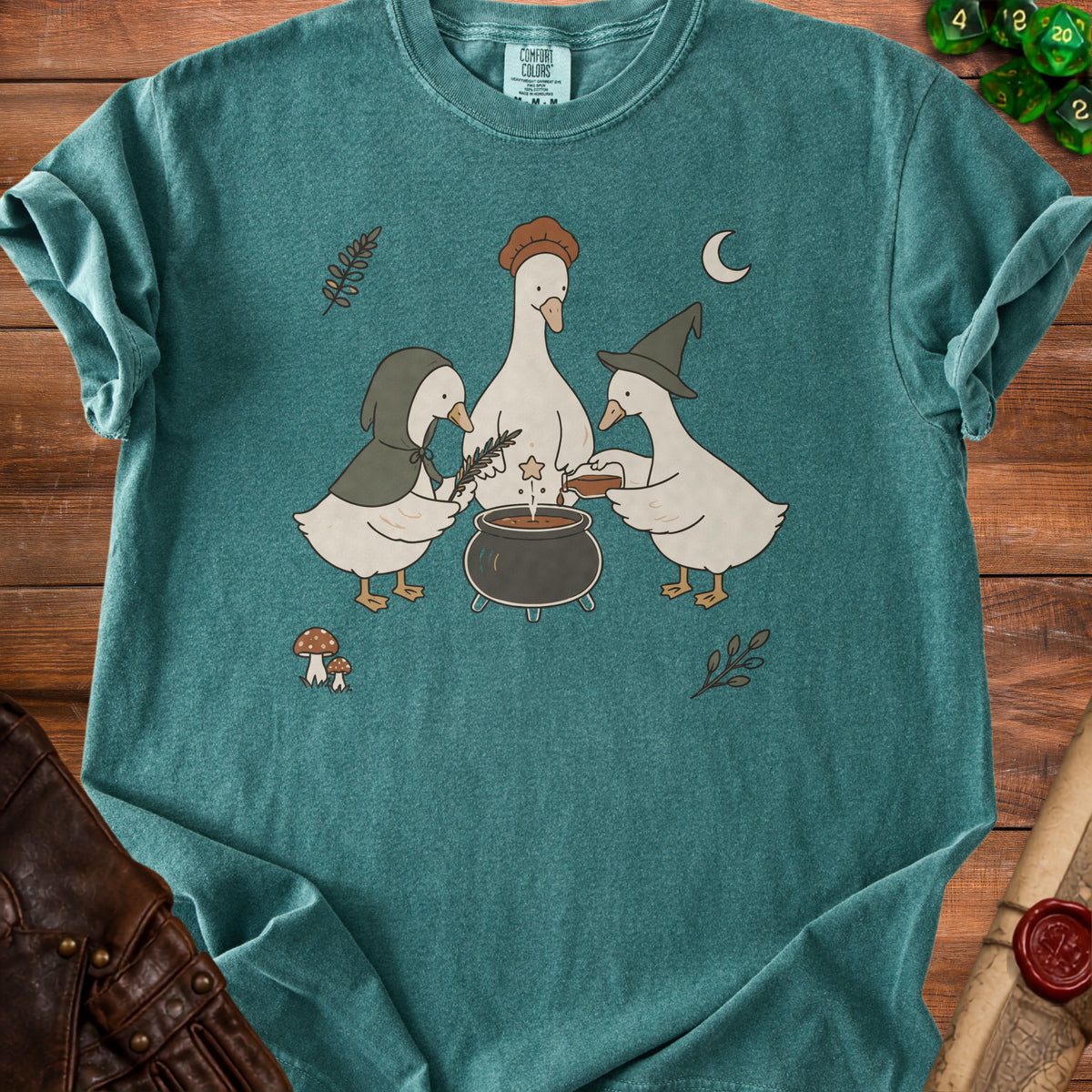 Three geese gather around a cauldron under a crescent moon.