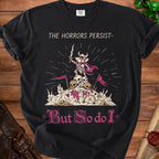 Black t-shirt with "THE HORRORS PERSIST-" and a mouse warrior on skulls.