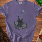 Purple t-shirt with graphic of wizard casting spell on floating islands with planets above.