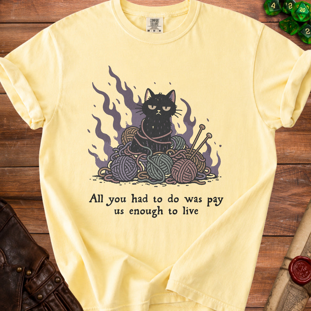 Yellow t-shirt with a black cat entangled in yarn and the text "All you had to do was pay us enough to live".