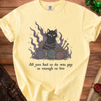 Yellow t-shirt with a black cat entangled in yarn and the text "All you had to do was pay us enough to live".