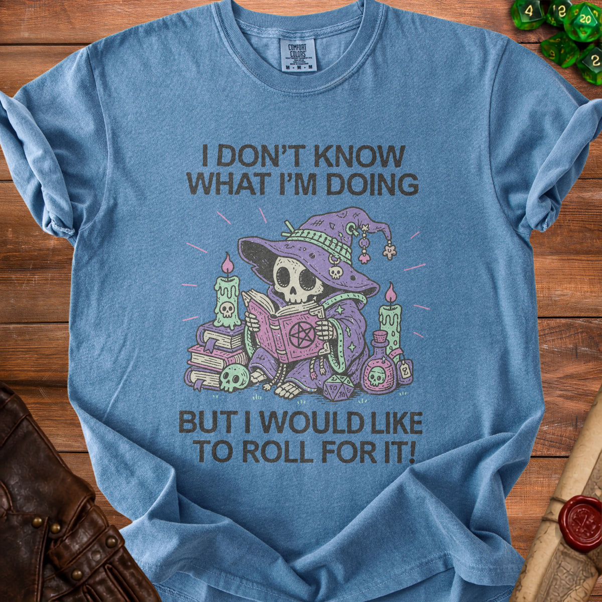 T-shirt with skeleton wizard reading book and text "I don't know what I'm doing but I would like to roll for it".