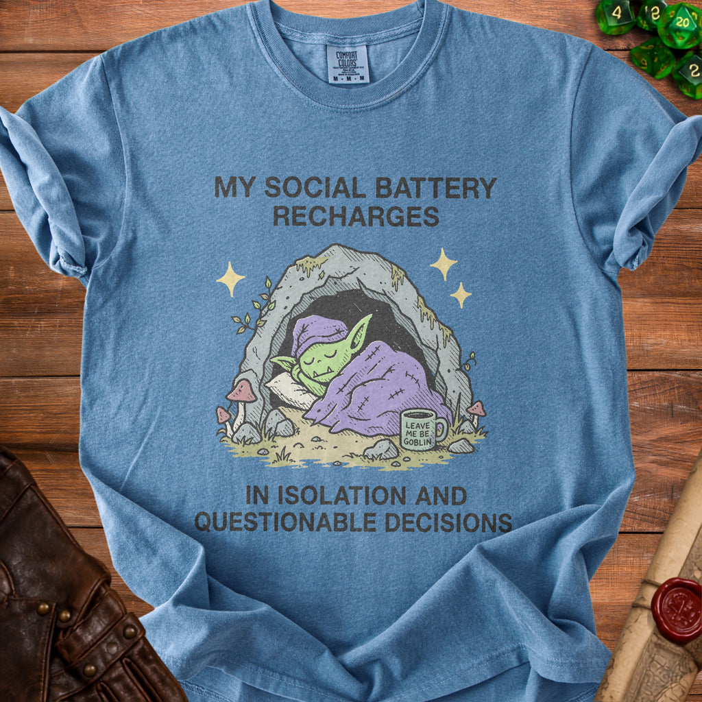 Blue t-shirt with graphic of sleeping goblin in cave and text "My social battery recharges".