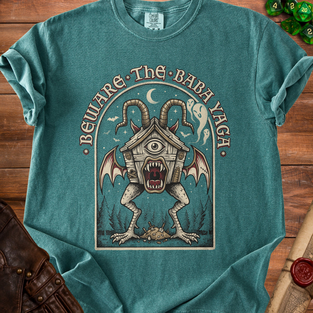 T-shirt graphic: Beware the Baba Yaga with a monstrous chicken-legged house.