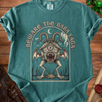 T-shirt graphic: Beware the Baba Yaga with a monstrous chicken-legged house.