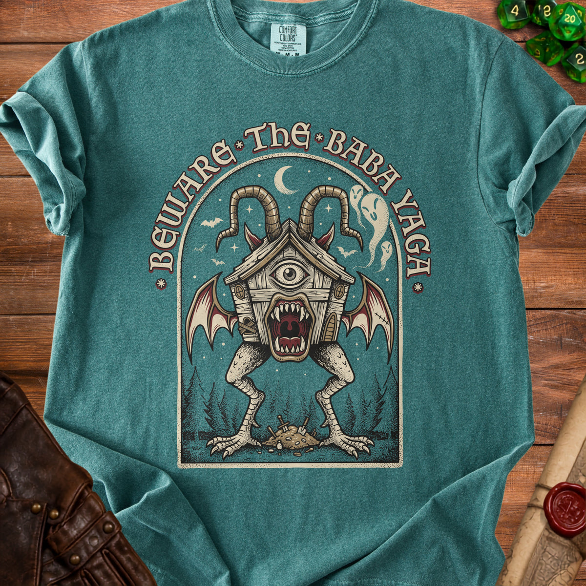 T-shirt graphic: Beware the Baba Yaga with a monstrous chicken-legged house.