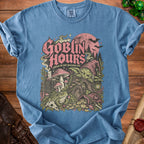 Blue t-shirt with "Goblin Hours please do not perceive me" graphic featuring a goblin.