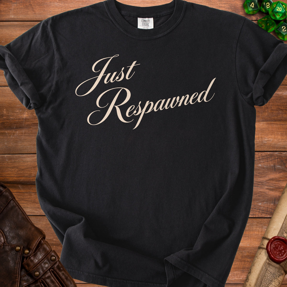 Black t-shirt with cream script text reading "Just Respawned".