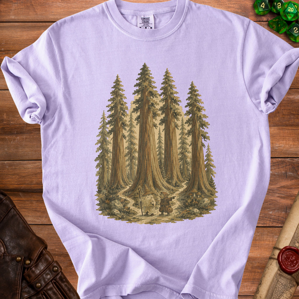 Purple t-shirt with wizard and goblin figures in a redwood forest illustration.