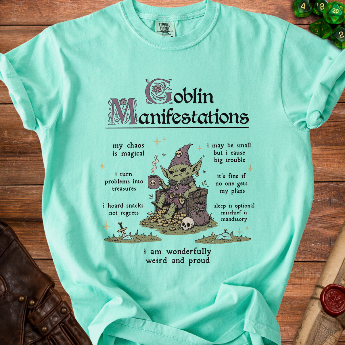 Mint t-shirt with "Goblin Manifestations" text and illustration of a goblin.