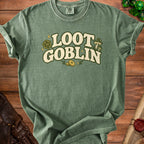 Green t-shirt with "Loot Goblin" text, dice, mushrooms, and coins graphic.