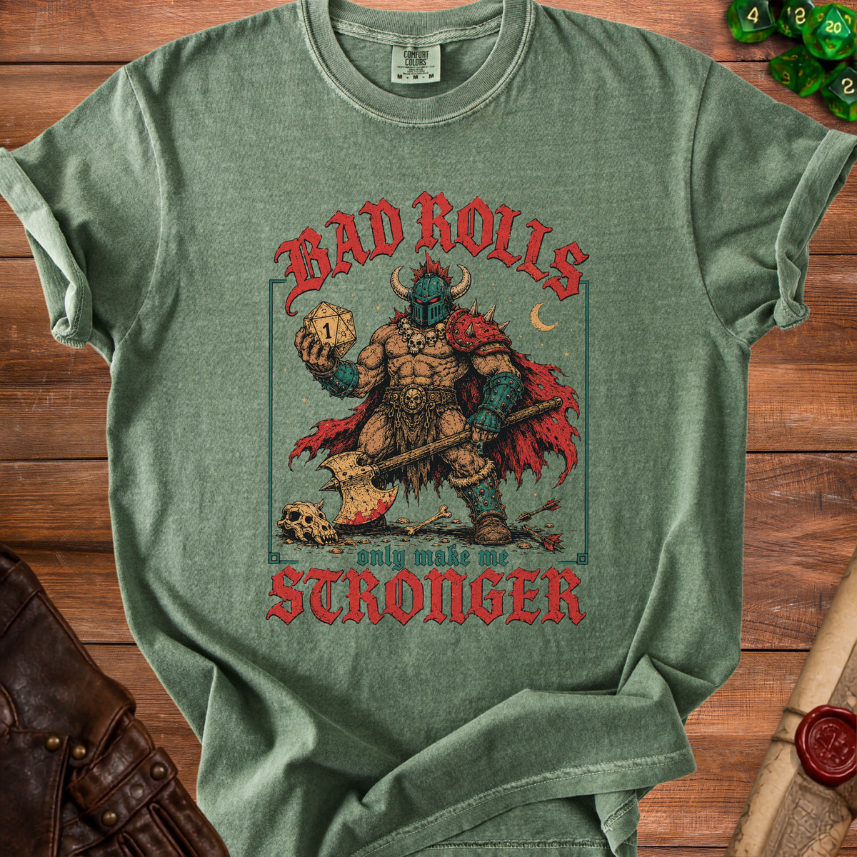 Green t-shirt with "BAD ROLLS only make me STRONGER" and barbarian graphic.