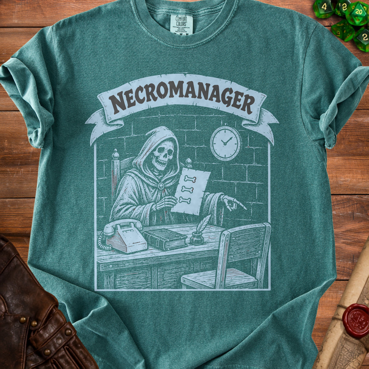 Green t-shirt with grim reaper illustration and "NECROMANAGER" text.