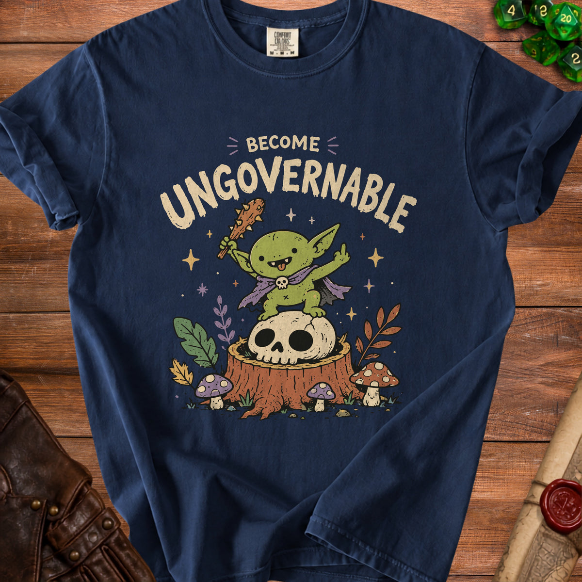 Navy t-shirt with a graphic of a goblin on a skull, holding a club, with text "BECOME UNGOVERNABLE".