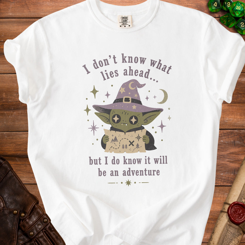 White t-shirt with goblin holding map, "I don't know what lies ahead, but I do know it will be an adventure."
