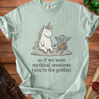 Light blue t-shirt with unicorn and goblin graphic and text.