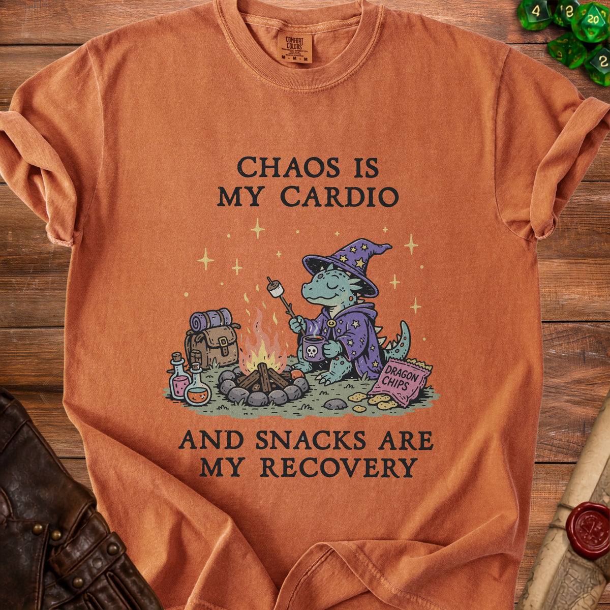 Orange t-shirt with a dragon wearing a wizard hat roasting a marshmallow and text.