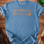 Blue t-shirt with orange text "OUT OF SPELL SLOTS" and dice icons.