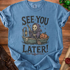 Blue t-shirt with Grim Reaper in a boat with pumpkin, text "See You Later!".