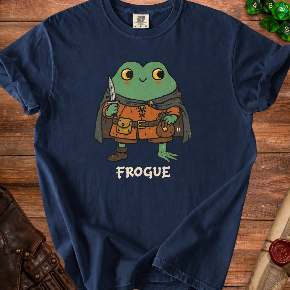 Frogue t-shirt featuring a cartoon frog rogue holding a knife and coin bag.