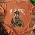 T-shirt with "Wild Magic" text and a fantasy witch holding a twenty-sided die.