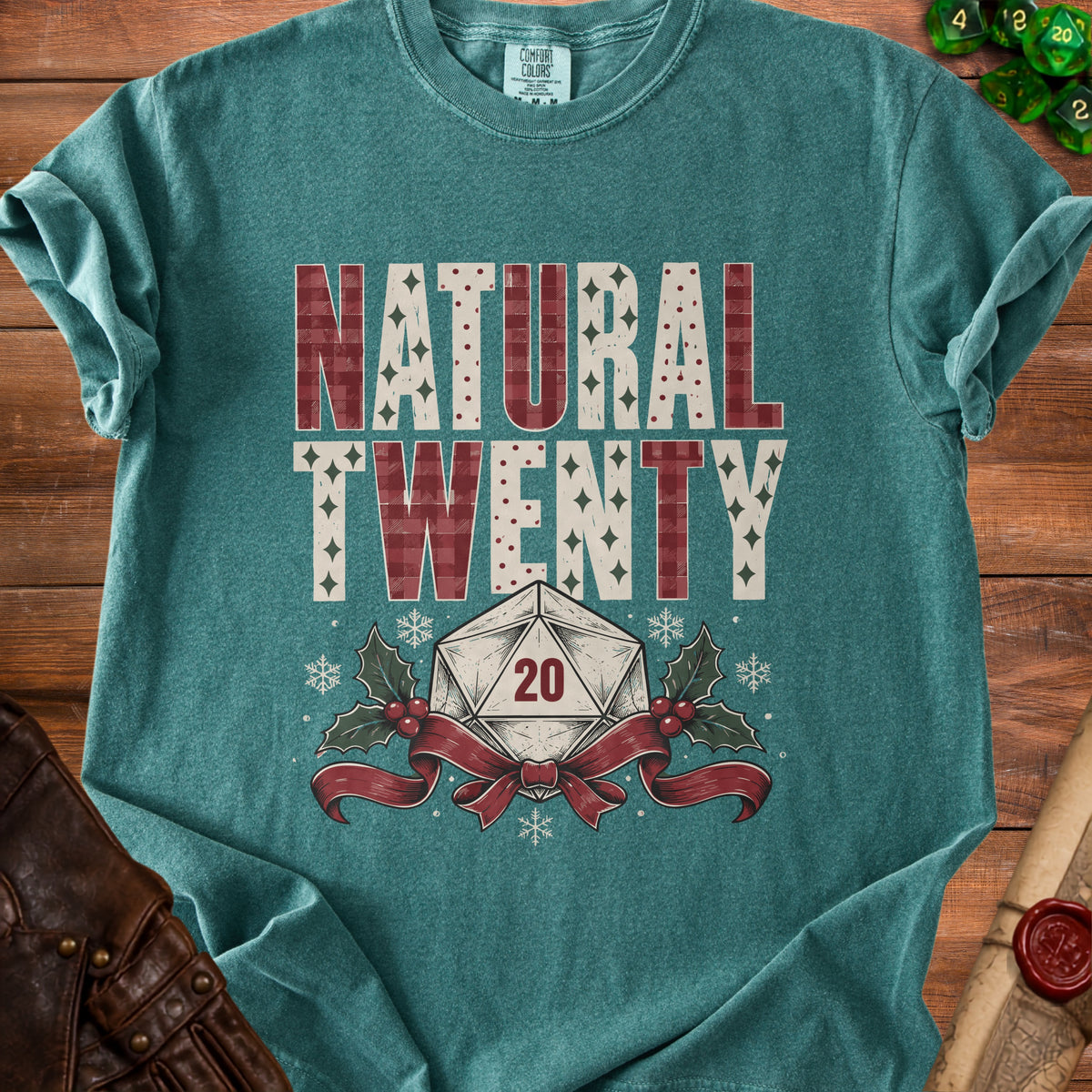 Teal t-shirt with "Natural Twenty" text and a d20 die with holly.