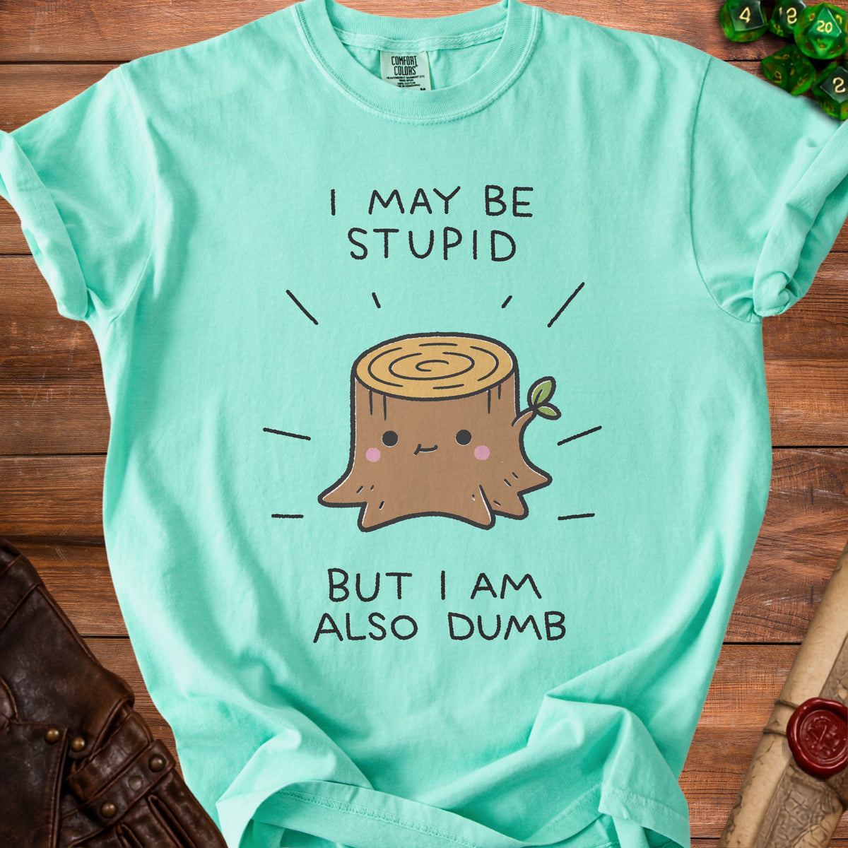 Mint green t-shirt with "I may be stupid but I am also dumb" text and tree stump graphic.